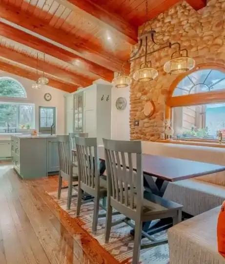 Custom-remodeled-kitchen-and-dining-area-with-stone-wall-and-wood-ceiling Custom remodeled kitchen and dining area with stone wall and wood ceiling