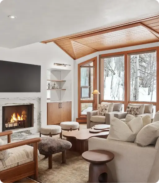 Custom-remodeled-living-room-with-fireplace-sectional-seating-and-snowy-mountain-views Custom remodeled living room with fireplace, sectional seating, and snowy mountain views
